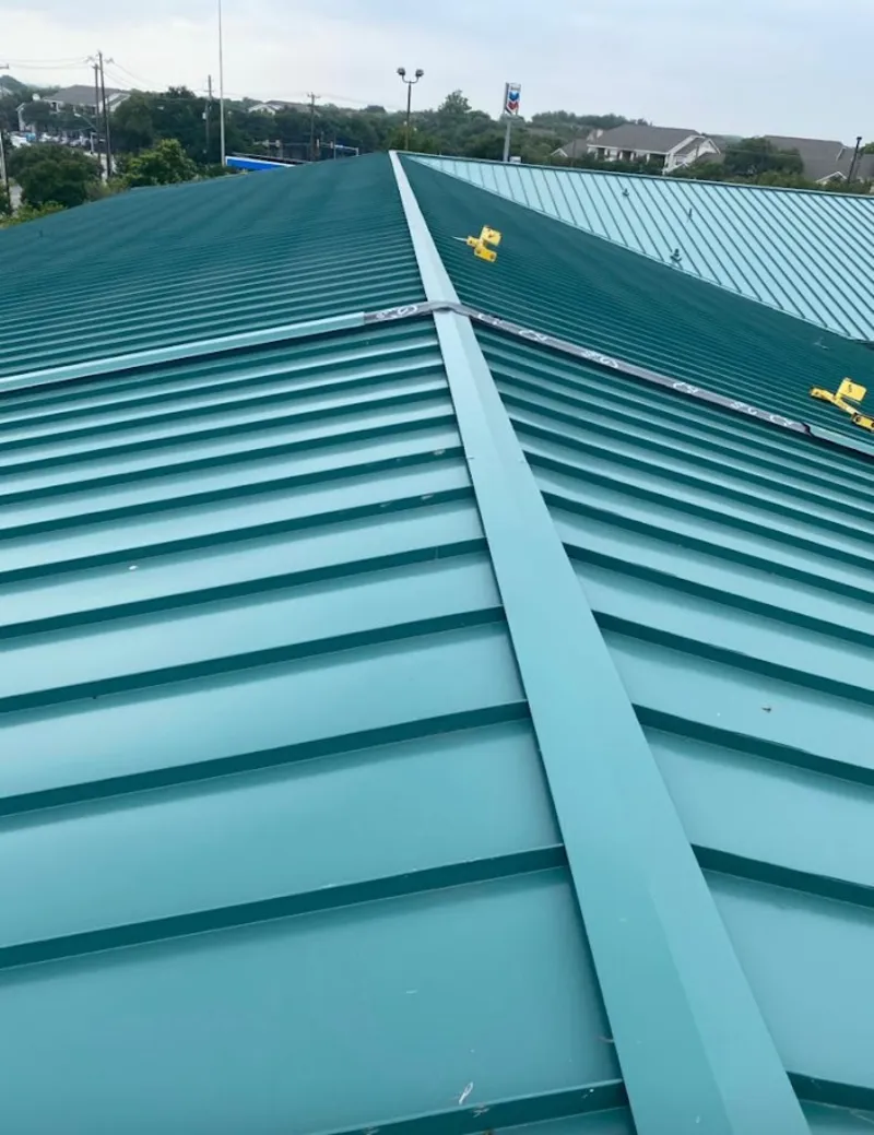 Green commercial metal roof ridge and valley for Metal Roof Repair in Milliken